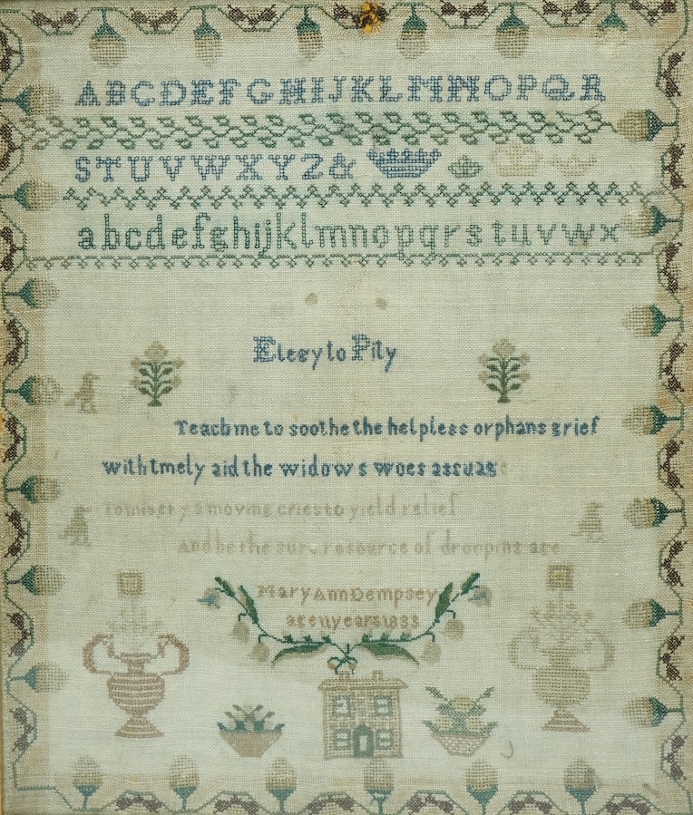 A George IV sampler, by Mary Ann Dempster aged 11 years, dated 1833. Embroidered with an alphabet, verse and spot motifs of a house, birds and flowers, within a stylistic vine border. 37cm wide x 45cm high. Condition - a
